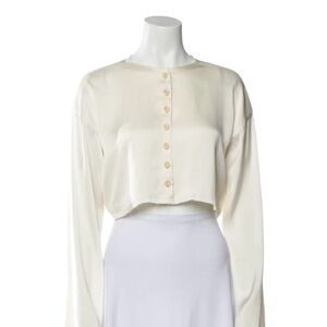 Orseund Iris cropped frayed blouse in cream with bell sleeves